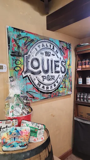 Painted mural of the Louie's P&R Italian Market logo, established 1957
