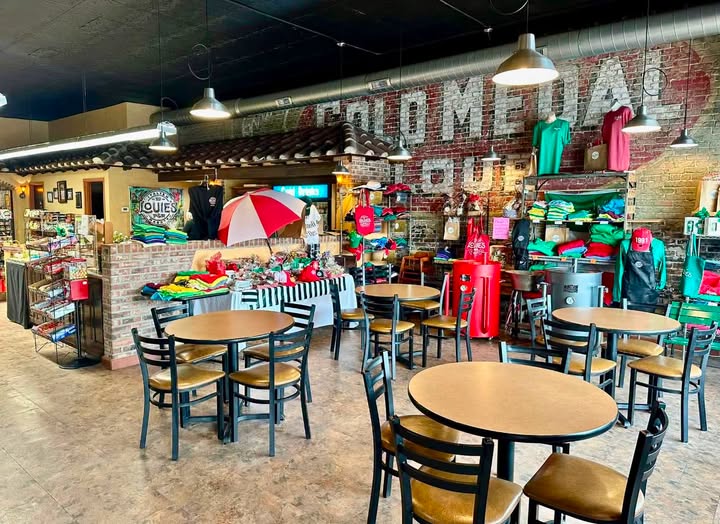 Inside the store: brick walls, café tables, and merchandise